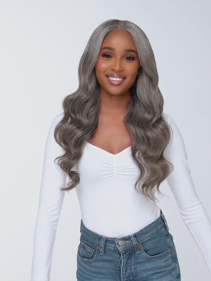 Styled application of Indique Pure Gray Wavy wefted extensions, showing effortless movement and body.