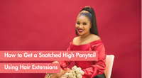 Woman in red top demonstrating high ponytail hairstyle with hair extensions.